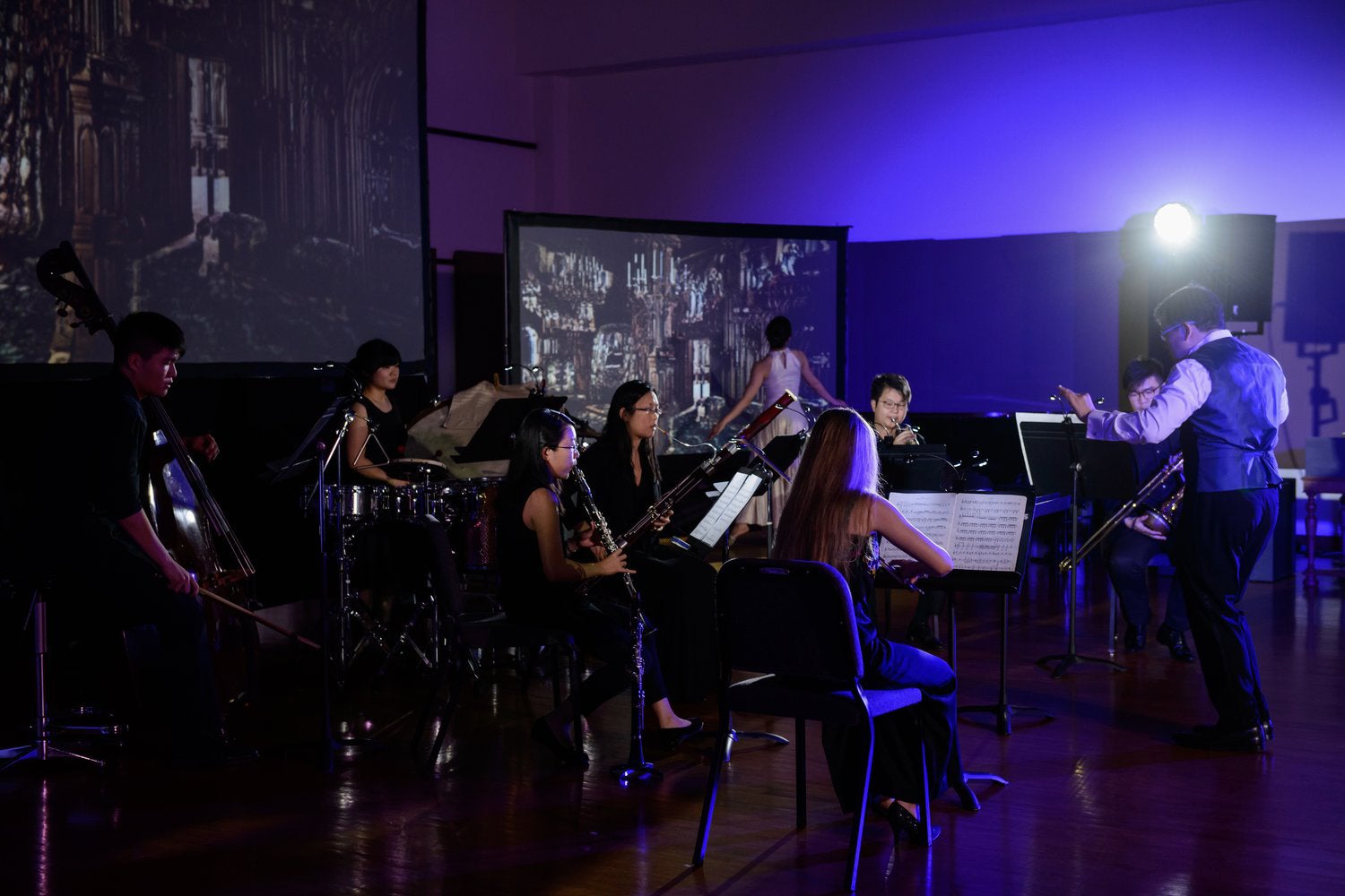 Performers in The Primitive presenting Stravinsky's L'histoire du Soldat, featuring multimedia visuals and dance.