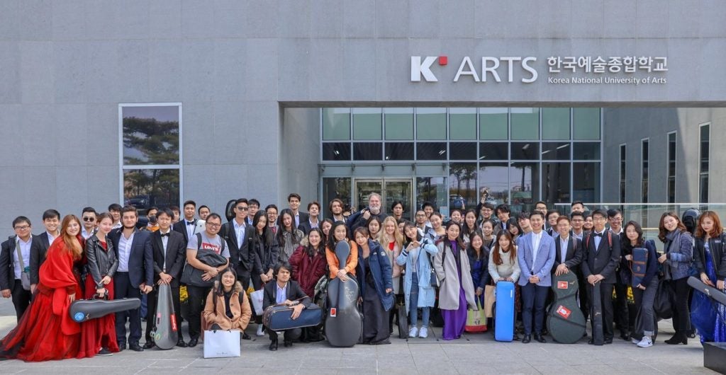 The YST Conservatory Orchestra in front of the Korea National University of Arts.