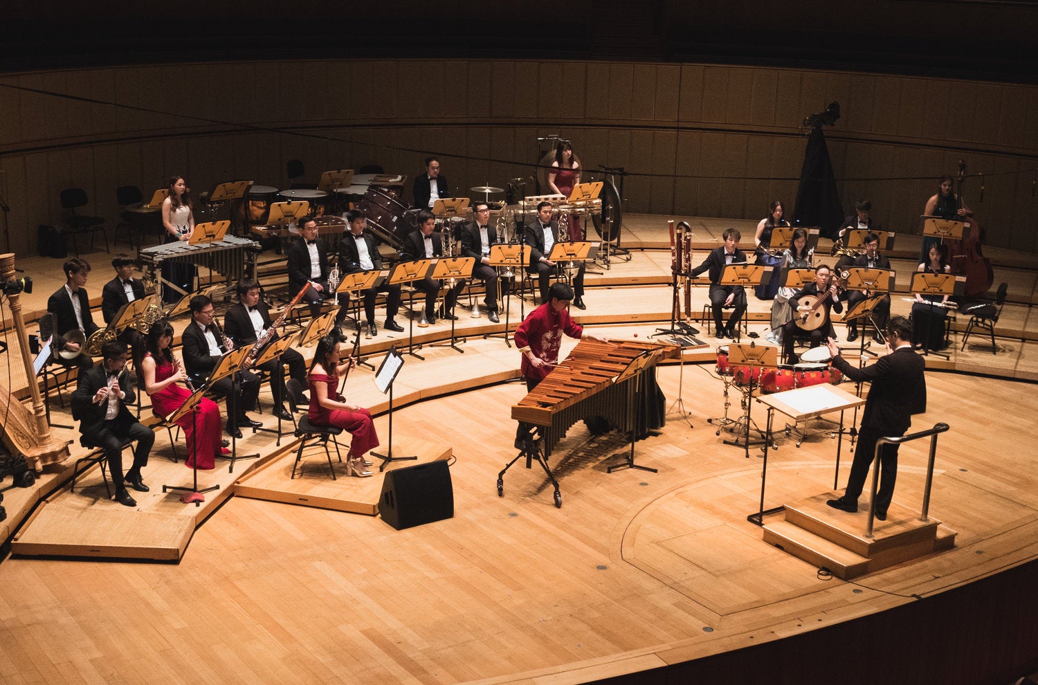 As part of the Conservatory Orchestra’s Korea tour, Sulwyn (on right, holding zhongruan) was one of three soloists premiering a work by Asst Prof Chen Zhangyi for Chinese instruments and ensemble.